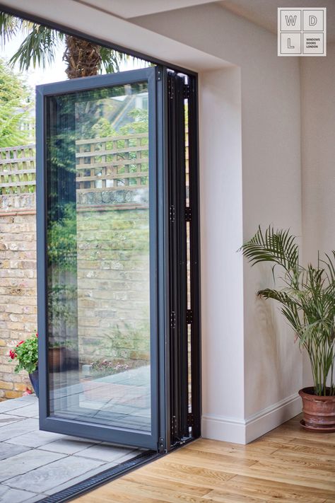 Exceptional Aluminium Bifold door by Windows Doors London. Contact us for more details. #AluminiumGermanWindows #German Windows #GermanWindowsLondon #AluminiumBifoldDoors#AluminiumCasementWindows #LondonWindows #AluminiumWindowsLondon #Aluminium Windows #AluminiumWindowsSurrey #SurreyWindows #WDL #WindowsDoorsWindows #WindowsSupplierLondon Aluminium Windows Ideas, German Windows, Bifold Door Ideas, Aluminum Windows Design, Aluminium Bifold Doors, Modern Kitchen Extensions, Modern Windows And Doors, Windows Aluminium, Bifold Patio Doors