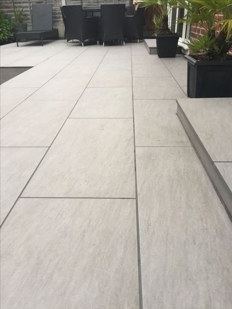 Outdoor porcelain tiles Modern Outdoor Tiles Design, Light Grey Porcelain Patio, Outside Floor Tiles Outdoor, Outdoor Porcelain Tile Patio Floor, Outdoor Tiled Patio, Porcelain Patio Paving Ideas, White Stone Patio, Patio Tiles Ideas, Porcelain Outdoor Tiles