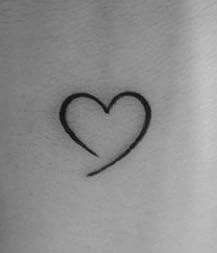 Heart Tattoo With Meaning, Black Heart Wrist Tattoo, Heart Tattoo On Forearm, Small Heart Tattoo Placement, Small Love Heart Tattoo, Hart Tattoo Design, Mini Tattoos Heart, Minimalistic Heart Tattoo, Heart Wrist Tattoos