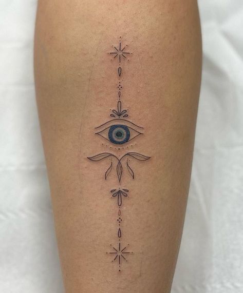 18 Unique Evil Eye Tattoo Designs for Charm and Positivity Fineline Evil Eye Tattoo, Sun Evil Eye Tattoo, Protection From Evil Eye Tattoo, Eyes Tattoo Ideas Women, Evil Eye Back Tattoo Women, Evil Eye Tattoo Leg, Tiny Spiritual Tattoos For Women, Minimalist Tattoo Evil Eye, Mexican Evil Eye Tattoo