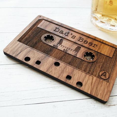 Fun Fact! Did you know the compact cassette was designed in the sixties and used for dictation before they were used for recording music? It also seems they are making a bit of a comeback amongst enthusiasts! You can jump on the trend with our personalised solid wooden version that doubles as a quirky drinks coaster. #cassettetapes #woodpaperscissors #designwithastory #madefromwood #womanwoodworkers #thoughtfulgifting #cornwallbusiness #retrocommunity #madebytheocean #cassettecollection #m... Retro Drinks, Book Club Food, Valentine Gift For Dad, House Keyring, Musical Gift, Wooden Cards, The Sixties, Personalized Coasters, Wooden Coasters