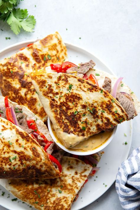 Crispy, cheesy steak quesadillas are stuffed with tender steak and pepper strips and served with a spicy chipotle queso sauce for dipping. Chipotle Queso, Chipotle In Adobo Sauce, Cheese Quesadilla, Fresh Salad Recipes, Mexican Dinner, Juicy Steak, Different Vegetables, How To Cook Steak, Vegan Options