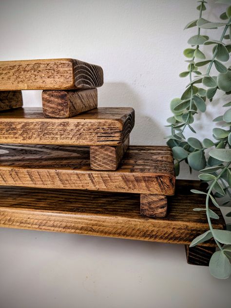 These handmade wooden countertop trays / risers are the perfect  way to display candles, plants, kitchen and bathroom items, or your crafts - you can use your imagination! Completely reclaimed, only using safe, environmentally sourced timber, finished in a lovely dark oak wax, that really brings out the beautiful grain.  A number of different sizes to suit whatever you want to display! Get a bargain by buying all options! NO EXTRA DELIVERY COST FOR MULTIPLE ITEMS! (UK) Small 12.5cm X 9.5 X 4.5cm Medium 20.5cm X 9.5 X 4.5cm Large 28cm X 9.5 X 4.5cm Extra-Large  35.5cm X 9.5 X 4.5cm Please note! All our products involve wood, a natural material that will move over time. Although we try our best, there may be shakes, knots, imperfections or gaps that appear when joining pieces.