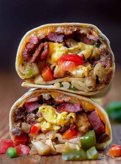 A Cowboy Breakfast Burrito is a savory and hearty breakfast option loaded with meats, vegetables, seasonings, eggs, and cheese wrapped in a tortilla and pan-fried to perfection! It is sure to satisfy even the biggest appetites and keep you going all morning. Ultimate Breakfast Burrito, Cowboy Breakfast Burrito, Breakfast Ideas For Restaurant, Steak Breakfast Burrito, Unique Breakfast Ideas, Burritos Recipes, Cowboy Breakfast, Outdoor Breakfast, Morning Breakfast Ideas