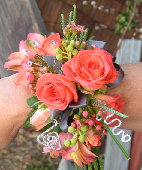 coral corsage with deco wire~Stems Flower Shop Coral Corsage, Prom Flowers Corsage, Corsage Ideas, Homecoming Flowers, Hoco 2024, Prom Corsages, Prom Corsage And Boutonniere, Homecoming Corsage, Prom Bouquet