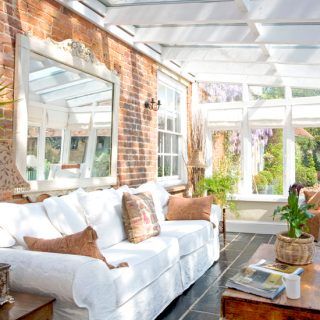 Conservatory with brick wall and ornate mirror | Easy conservatory transformations | Conservatory | PHOTO GALLERY | Housetohome.co.uk Conservatory Interiors Ideas, Small Conservatory Interiors, Brick Sunroom, Conservatory Ideas Interior Decor, Conservatory Ideas Interior, Small Conservatory Ideas, Conservatory Interiors, Small Conservatory, Lean To Conservatory