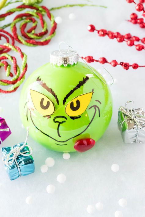 This DIY Grinch Ornament is easy to make and the perfect addition to any Christmas tree decor. Your heart will grow three sizes while making it! #grinch #grinchornament #diygrinchornament #homemadeornaments #DIY #grinchmas Diy Grinch Ornaments, Diy Grinch, Grinch Ornament, Grinch Crafts, Grinch Christmas Tree, Grinch Christmas Decorations, Grinch Ornaments, Homemade Ornaments, Christmas Crafts To Make