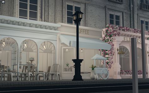 Realistic Bloxburg Cafe Exterior, City Builds Bloxburg, Nyc Cafe Bloxburg, Bloxburg Paris Town Layout, Bloxburg Shop Exterior, Paris Bloxburg Layout, Costal Town Bloxburg, Bus Stop Bloxburg, Bloxburg Fancy Restaurant