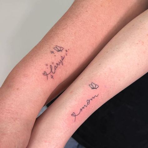 Dainty Tattoos For Mom And Daughter, Fine Line Tattoo Mother, Fine Line Mom Tattoo, Tattoo Ideas For Mom And Daughter, Daughter Name Tattoos For Mom, Matching Tattoos For Mom And Daughter, Fine Line Name Tattoo, Butterfly Tattoo With Name, Matching Mom And Daughter Tattoos