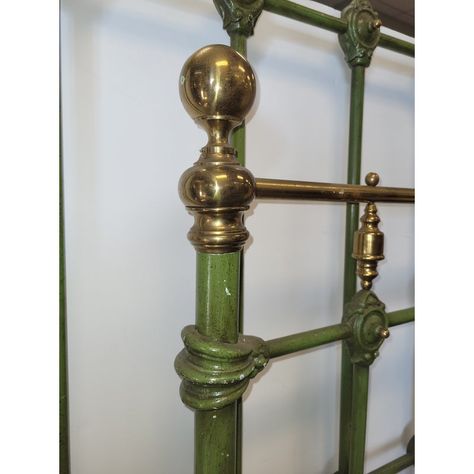 Fantastic antique green enamel painted iron bed frame with brass accents. Dating to the early 20th century, factury painted with a moss green enamel paint, in an iron frame, designed with detailed iron and brass motifs. Measuring 46 inches wide and 57 inches tall for the headboard and 46 inches wide and 43 inches tall for the foot board. This is a rare form bed in good condition; minor dings to brass finials and minor paint chips. No Rails. Extremely heavy. For a small extra charge I can have ra Vintage Brass Headboard Bedroom, Antique Brass Bed Bedroom Ideas, Gold Accent Bedroom, Brass Bed Bedroom Ideas, Vintage Iron Bed, Gold Accents Bedroom, Painted Iron Beds, Brass Headboard, Bedroom Antique