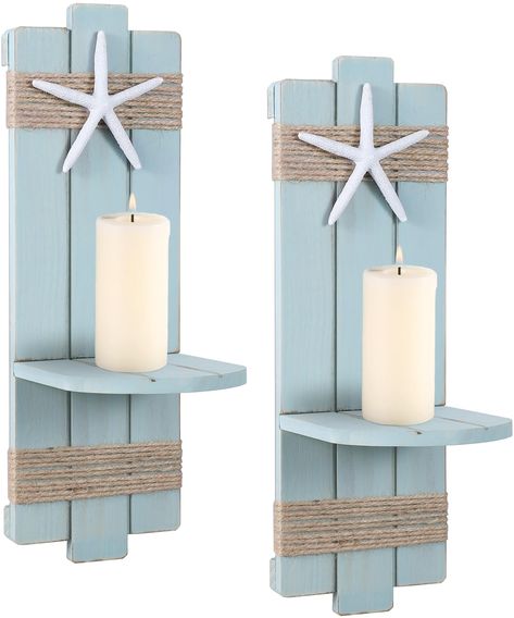 PRICES MAY VARY. Farmhouse Beach Charm: Add a touch of rustic elegance to your home decor with these vintage wood candle sconces.A resin starfish is attached to the hemp rope, lending a coastal and beach-inspired vibe to the candle holders. Handcrafted with Care: Each candlestick holder is constructed from high-quality wood, ensuring durability and longevity. The distressed finish gives them an authentic vintage look, adding character and charm to your decor. The set includes two candle holders, Beach Themed Room Decor, Wall Candle Sconces, Seashell Candle Holder, Coastal Room Decor, Wall Mounted Candle Holders, Seashell Candles, Wall Candle, Beach Bathroom Decor, Candle Displays