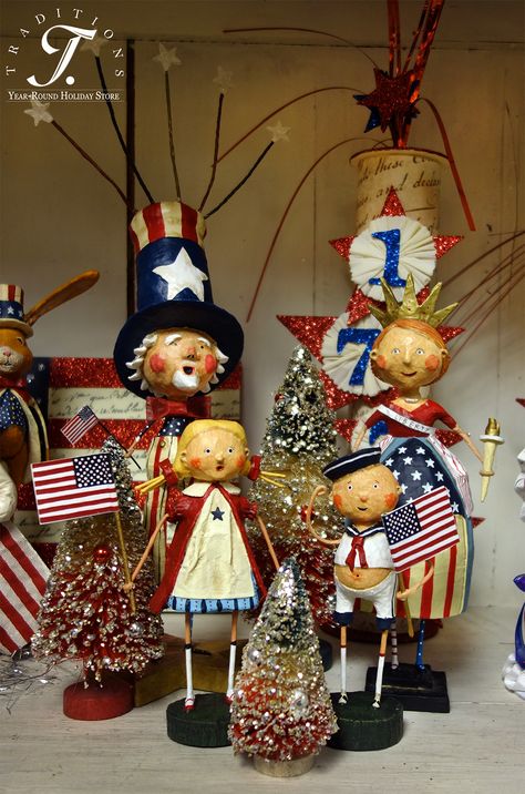 Lori Mitchell's sense of style and proportion speaks to so many collectors that her folk art line is one of the most popular collections at Traditions! Her patriotic figures are especially fun and easy to decorate with. We love how she blends traditional patriotic themes like firecrackers, Uncle Sam, Miss Liberty and marching parade children, and then puts her own spin on these themes with her characteristic spindly legs, exaggerated proportions and sweet faces! Patriotic Doll, July Decoration, Lori Mitchell, Vintage Patriotic, Fourth Of July Decorations, Themed Decorations, July Ideas, Fourth Of July Decor, July Decor