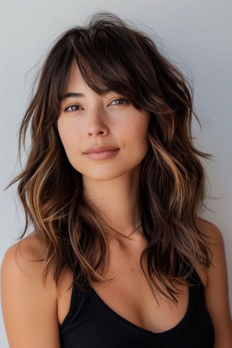 Whether you’re seeking a subtle change or a bold new look, we’ve got you covered with over 50 fabulous medium length hairstyle ideas to inspire your next salon visit or DIY hair adventure. From sleek bobs to tousled waves, vibrant hues to natural textures, you’ll find all the medium-length hair inspo you need! Let’s dive into these chic medium-length hairstyle ideas that are bound to elevate your look and leave you feeling confident and fabulous! Medium Length Haircut Beach Waves, Medium Textured Haircut With Bangs, Shaggy Mid Length Hair Side Part, Medium Brown Shag Hair, Round Face Haircuts Curtain Bangs, Side Part Collar Bone Length Hair, Medium Length Wavy Haircut With Bangs, Medium Length Wolf Cut No Bangs, Shag Medium Haircut