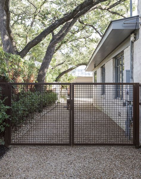 There is something sinister about a landscape of rusted metal: a corroded car off the highway, a forgotten Midwestern town, or a decaying seaport. The visc Metal Driveway Gates, Pergola Design, Front Yard Fence, Pool Fence, Front Gates, Lan Can, Fence Landscaping, Modern Fence, Metal Fence