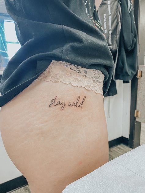 stay wild tattoo Stay Wild Hip Tattoo, Wild Love Tattoo, Keep Her Wild Tattoo, Rebellious Tattoos For Women, Wild As Her Tattoo, Stay Wild Tattoo Ideas, Stay Wild Buttcheek Tattoo, Wild One Tattoo, Wild Tattoo Word