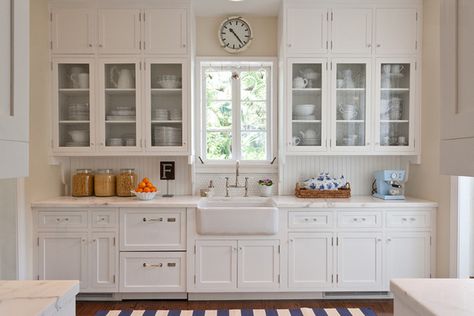 Mediterranean Revival- I like the white cabinets, but I'd want some color on the walls. 1920s Kitchen Cabinets, House Inspection, Sink Window, Glass Kitchen Cabinet, 1920s Kitchen, 1930s Kitchen, Glass Kitchen Cabinet Doors, Glass Kitchen Cabinets, Bungalow Kitchen