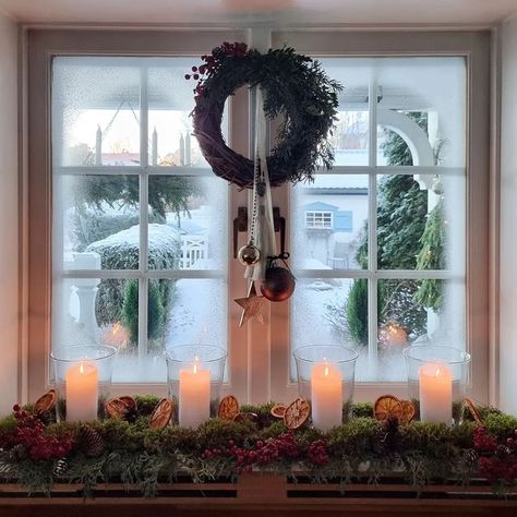 Anna-Lena Lindqvist on Instagram: "View from our kitchen on a frosty day last year (I have also sprayed fake snow on the window here to make It more frosty) I haven't started decorating for Christmas yet this year, there hasn't been time. We came home from Latvia on Sunday evening tired but happy after celebrating my husbands birthday with friends there. Our kids picked us up at the airport and surprised us with a new TV plugged in and ready with all the apps downloaded. Such a great 50th birt Christmas View From Window, Holiday Candle In Window, Window Fake Snow Ideas, Fake Snow Spray Window Ideas, Fake Snow Decorations Window, Fake Snow Window Ideas Spray, Fake Snow On Windows, Snow On Windows Spray Ideas, Christmas Bay Window Decorations