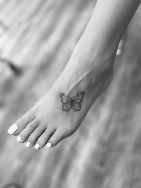 Foot Tattoo Black Women, Foot Butterfly Tattoo, Butterfly Tattoo Foot, Butterfly Tattoo On Foot, Butterfly Foot Tattoo, White Butterfly Tattoo, Trend Tattoo, Ivy Tattoo, 2024 Tattoo