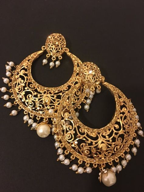 beautiful big size handcrafted gold plated Hyderabadi chandbali earrings. The earrings are embellished with stones and pearls to finish the look. Chand Bali Earrings Gold, Hyderabadi Jewellery, Handmade Necklace Designs, Hyderabadi Jewelry, Sabyasachi Jewellery, Gold Earrings Models, Bridal Jewellery Design, Indian Jewellery Design Earrings, Bridal Gold Jewellery Designs