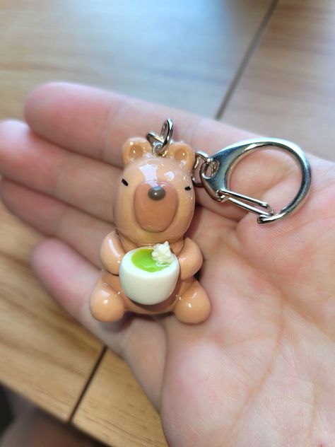 capybara and his matcha latte! made with polymer clay and sealed with resin for a glossy finish 💗 Polymer Clay Capybara, Clay Capybara, Capybara Clay, Capybara Keychain, Cute Polymer Clay Charms, Desk Buddies, Cute Capybara, Pottery Projects, Clay Figurines