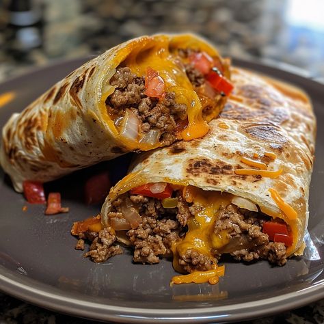 Translated into English: **Beef and Cheese Burrito 🌯🧀** 📋 **Ingredients:** - 400g ground beef - 1 onion, chopped - 1 red bell pepper, diced - 1 can black beans (400g), drained and rinsed - 200g shredded cheese - 4 wheat tortillas - 2 tbsp olive oil - Salt and pepper - Burrito spices (cumin, paprika, chili powder) 🥣 **Instructions:** 1. Heat olive oil in a skillet over medium heat. 2. Add onion and red bell pepper, sauté until tender. 3. Add ground beef and cook until browned. 4. Stir in bla... Tacos Ground Beef, Ground Beef Burritos, Cheese Burrito, Salvadorian Food, Can Black Beans, Salsa Guacamole, Wheat Tortillas, Food C, Foreign Food