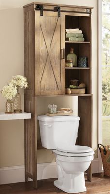 While most homeowners make sure that their kitchen has plenty of storage, they often neglect their bathrooms. There is a lot of unused space in the ba... | -barn-door Bathroom Cabinet Makeover, Toilet Cabinet, Bathroom Cabinets Diy, Bathroom Cabinets Designs, Diy Bathroom Storage, Small Space Storage, Small Bathroom Storage, Toilet Storage, Small Cottage