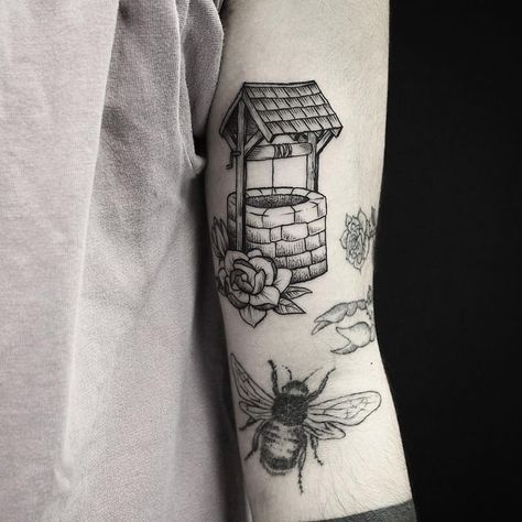 Blackwork wishing well tattoo on the left upper arm Wishing Well Tattoo, Well Tattoo, Men Flower Tattoo, Related Tattoos, Places To Get Tattoos, Body Decoration, Watch Tattoos, Sketch Tattoo Design, Sleeve Ideas