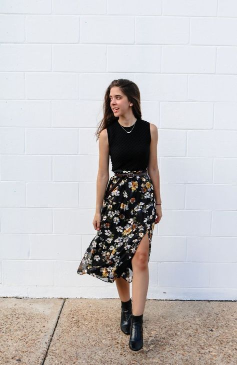 This midi-length skirt combines classic elegance with a vibrant twist. The skirt features a striking black and yellow floral pattern, adding a pop of color and energy to your outfit. The combination of the dark black background and the lively yellow blooms creates a captivating contrast that's both chic and eye-catching. Perfect for a stylish and versatile wardrobe addition.