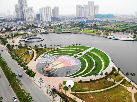 Astronomy Park is a public park project in Hanoi. The project is located in a new development area in the West of the city and is Vietnam’s first astronomy park. Construction project surrounds Bach Hop Thuy lake, an abandoned detention basin of Duong Noi urban area. This project is a boost to the real estate while also significantly improving the quality of life and public space in the new district of Hanoi. Lake Park Design, Public Park Design, City Parks Design, Park Concept, Eco Park, Park Project, River Side, Water Playground, Park Photography