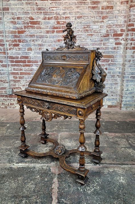 19th century Highly carved Italian Drop Leaf Desk w/ Griffin & Putti  Dimensions : 53" H x 32" W x 17" D Fantasy Desk, Antquie Desk, Art Nouveau Furniture Antiques, Carved Wood Desk, Gothic Study, Rococo Desk, Drop Leaf Desk, Art Nouveau Desk, Victorian Desk