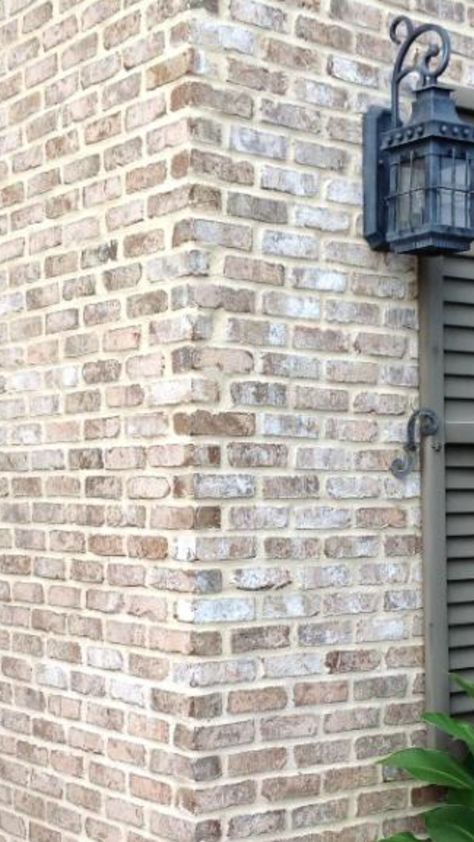 German Smear Brick Ranch House, Beige Limewash Brick Exterior, Over Grout Brick Exterior, Limewash Brick Interior, Light Color Brick House Exterior, Exterior Brick Fireplace, Light Limewash Brick Exterior, Lime Wash Outdoor Brick, Lime Washed Red Brick Exterior