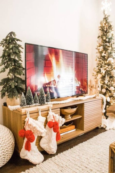 20 Christmas TV Stand Styling Ideas » Lady Decluttered Tv Stand Christmas Decor, Christmas Decorations Apartment, Apartment Christmas, Cozy Christmas Decor, Christmas Apartment, Christmas Decor Inspiration, Simple Christmas Decor, Christmas Themes Decorations, Christmas Decorations Living Room