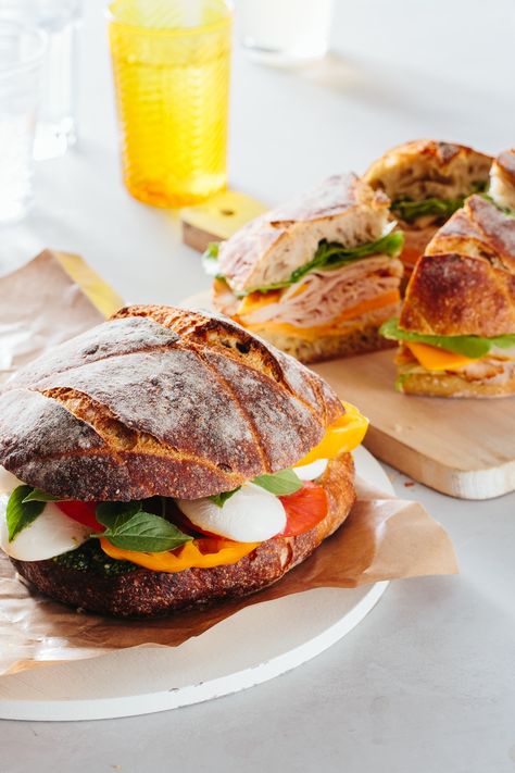 If you're looking for food for a large crowd, look no further than this guide for making a sturdy, stable, DELICIOUS, caprese sandwich. Perfect for parties or picnics, and it's a cheap and filling way to feed guests dinner. Be sure to follow our deli-approved guide to building the perfect sandwich. Summer Dinners For A Crowd, Sandwich For A Crowd, Dinners For A Crowd, Caprese Sandwich, Easy To Make Dinners, Lunch Appetizers, Dinners To Make, Food For A Crowd, Party Foods