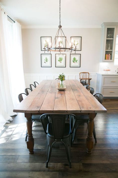 A former Fixer Upper client reveals what it’s really like to have Chip and Joanna Gaines renovate your home. Here, the dining room table is farmhouse beautiful! Wood Table With Wood Floors, Wood Table With Metal Chairs, Partial Shiplap Wall Dining Room, Kitchen Table With Metal Chairs, Chandelier Over Farmhouse Table, Dining Room Table Dark Floors, Farmhouse Table Light Fixture, Wood Table Metal Chairs, Metal Chairs With Wood Table