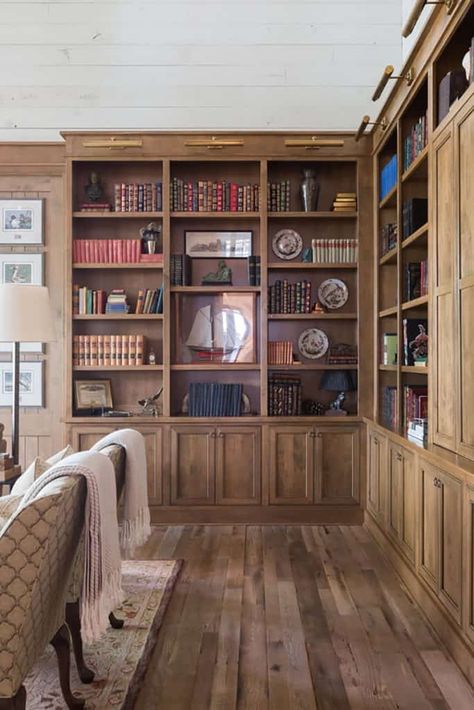 Fresh and inviting hideaway with rustic details on Florida's bayfront Natural Wood Bookshelves Built Ins, Natural Wood Built In Bookshelves, Stained Wood Office Built Ins, Stained Wood Built Ins Living Room, Wood Stain Built In, Natural Wood Bookshelves, Stained Built In Bookshelves, Wood Library Design, Stained Bookshelves