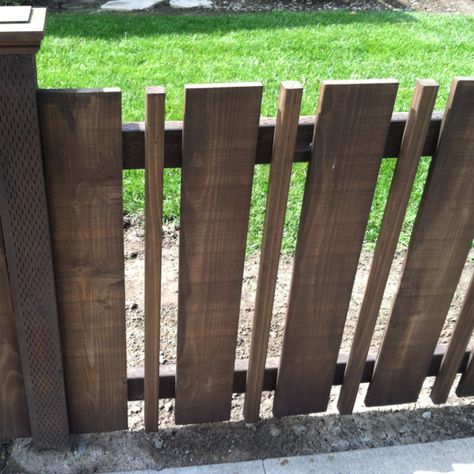 Now here's an idea I can use.  My pickets are too far apart and I was considering stapling netting to the back to prevent Django from just walking through the spaces.  But this might be just as inexpensive, and I like the look! Fencing Design, Front Fence, Brick Fence, Pallet Fence, Diy Fence, Front Yard Fence, Modern Fence, Dog Fence, Fence Ideas