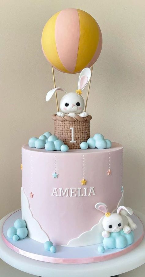 13. Cute bunny in hot air balloon cake Children’s parties are easy and fun to plan. All you have to do is to decide... Hot Balloon Cake, Baby Girl 1st Birthday Cake Ideas, Bunny Cakes Birthday Kids, Balloon Cake Ideas, Birthday Cake For First Birthday, Fondant Hot Air Balloon, 1st Birthday Cake Design, 1 St Birthday Cake, Hot Air Balloon Birthday Cake