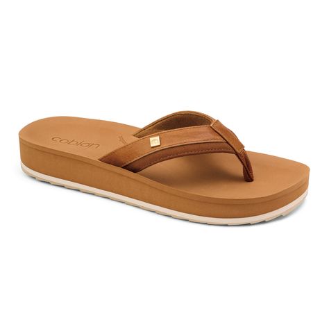 PRICES MAY VARY. Title: Cobian Women's Sandal Reya Rise Flip Flops. Product Type: Arborist Merchandising Root > Self Service > Special Features Stores > 80dbd58c-5608-4346-a9d0-64e6b7f46827_0 > 80dbd58c-5608-4346-a9d0-64e6b7f46827_8201 > 80dbd58c-5608-4346-a9d0-64e6b7f46827_228202 > Street, Surf & Skate Flip Flops For Men, Surf Skate, Self Service, Metal Pins, Natural Shapes, Tan Color, Synthetic Leather, Arch Support, Step Up