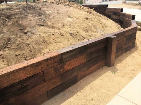 Where To Buy Railroad Ties For Sale in 2022 -The Ultimate Guide Rail Road Ties Retaining Wall, Railroad Ties Retaining Wall Ideas, Railroad Ties Landscaping, Railroad Tie Retaining Wall, Retaining Wall Patio, Retaining Wall Ideas, Farm Landscaping, Railroad Tie, Retaining Wall Design