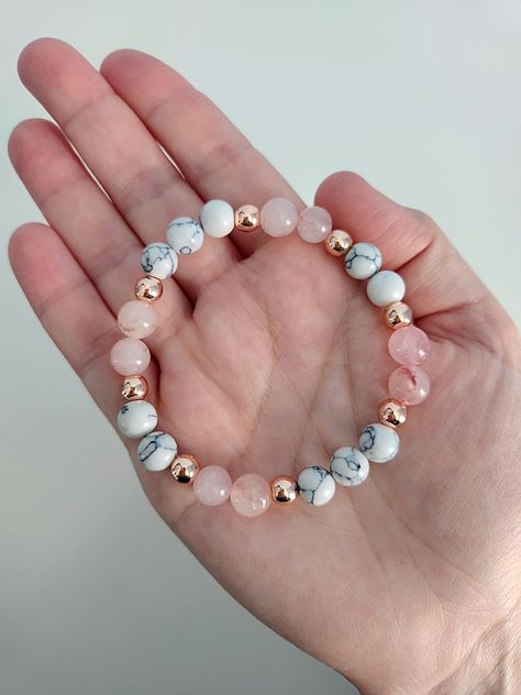 Absolutely stunning! This gorgeous gemstone bracelet features natural Rose Quartz, White Howlite and Rose Gold Hematite beads.  Beads are 8mm and 4mm. Bracelet stretches to fit. Coral Beaded Bracelets, Natural Bead Bracelets, Natural Beads Bracelet, Crystal Bead Bracelet Ideas, Bracelet Product Photography, Stone Bracelet Ideas, Crystal Bracelet Ideas, Bracelet Images, Cute Beaded Bracelets