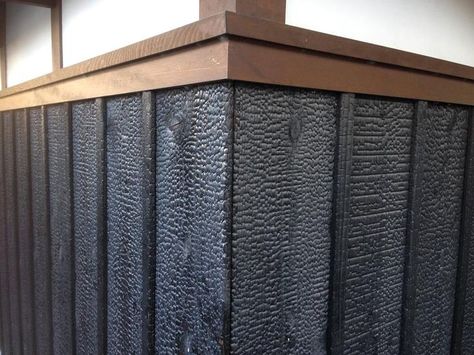 Traditionally, trim is often a slightly different color than the yakisugi (shou sugi ban) field. In this case it is intermediate between the jet black Suyaki and natural plaster upper wall. Japanese Exterior, Charred Wood Siding, Burnt Wood Finish, Wood Wall Covering, Fire Crafts, Zero Energy House, Burnt Wood, Charred Wood, Sugi Ban