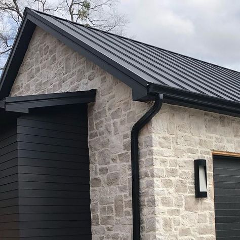 Stone Garage Exterior, Stone House Metal Roof, Black And Stone Exterior, Stucco And Board And Batten Exterior, Over Grouted Stone Exterior, Exterior Stone Ideas, Exterior Rock Siding, Stone Garage, Outside House Paint