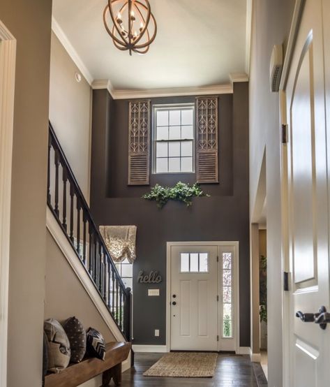 Above Entrance Door Decor, Above Front Door Ledge Decor, Decorating Inside Front Door Entryway, Entryway Slanted Wall, Wall Decor Above Front Door Inside, Nook Above Front Door, Foyer Window Ledge Decor, Front Door Foyer Ideas, Staircase At Front Door Entryway