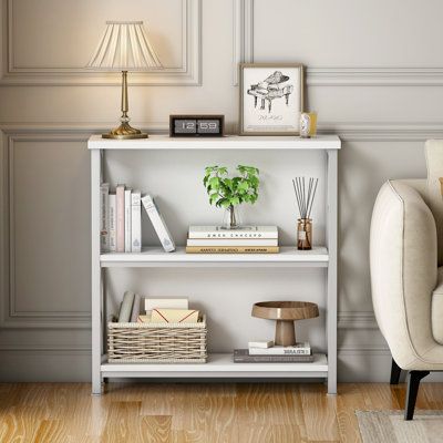 The overall dimensions of the bookshelf is 29.5"W x 12."D x 32.3"H. Crafted with sturdy metal frame in a powder-coated black finish, this bookcase features 3 tiers made from high grade engineered wood, which offers super stability and durability. Color: White | 17 Stories Koehn 32.3" H x 29.5" W Iron Standard Bookcase in White | 32.3 H x 29.5 W x 12 D in | Wayfair Small Bookshelf Styling, Bookshelf Farmhouse, Short Bookshelf, Farmhouse Small, Small Bookshelf, Living Room Home Office, Bookshelf Styling, Small Farmhouse, Etagere Bookcase