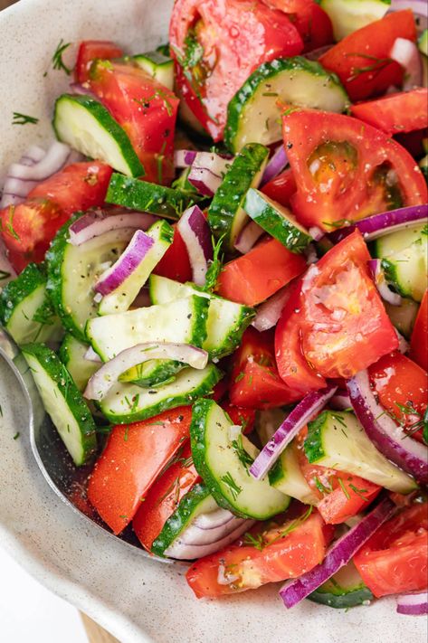 A bowl of cucumber and tomato salad with red onion and fresh dill. Colourful Salad, Tomato And Cucumber Salad, Tomatoes And Cucumbers, Tomato And Cucumber, Salad With Tomatoes, Fresh Salad Recipes, Dinner Salad, Best Salad Recipes, Charcuterie Recipes