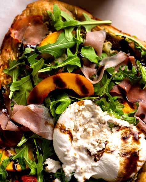 Peach season is right around the corner and this pizza is one of the best ways to utilize everyone’s favorite stone fruit! With a layer of pesto over a gluten-free focaccia crust, this pizza is topped with prosciutto, peaches, burrata, arugula & a balsamic glaze to create the perfect bite! Google ‘The Bottomless Pit Focaccia Crust Pizza’ for the full recipe or head to the link in my bio @the_bottomlesspit 🍕 Gluten Free Focaccia, Crust Pizza, Balsamic Glaze, Stone Fruit, Pizza Crust, Arugula, Around The Corner, Peaches, Pesto