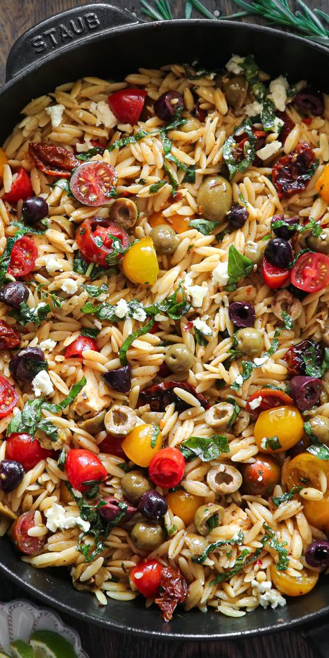 Greek Orzo with Tomatoes, Olives, Basil, and Feta - in a cast iron skillet. Pasta Salad With Tomatoes, Greek Orzo, Mediterranean Recipe, Mediterranean Recipes Healthy, Salad With Tomatoes, Mediterranean Diet Recipes Dinners, Orzo Recipes, Easy Mediterranean Diet Recipes, Greek Dishes