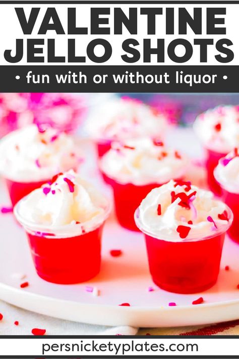 Celebrate Valentine's Day with your loved ones this year with these delicious Valentine's day jello shots! Made with layers of pink and red jello infused with clear vodka (or left non-alcoholic), they couldn't be easier to make. Topped with whipped cream and sprinkles, these irresistible jello shots are always a hit! | www.persnicketyplates.com Valentine Jello, Jello Shooters, Persnickety Plates, Cranberry Jello, Jello Flavors, Kid Friendly Drinks, Family Desserts, Jello Shot Recipes, Jello Shot