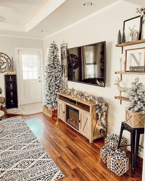 Tv Wall Christmas Decor, Christmas Living Room Inspiration, Floating Tv Stand Christmas Decor, Tv Console Holiday Decor, Christmas Wall Unit Decor, Floating Shelf Over Couch Christmas, Christmas Decor Tv Console, Media Console With Fireplace, Christmas Tv Console Decor