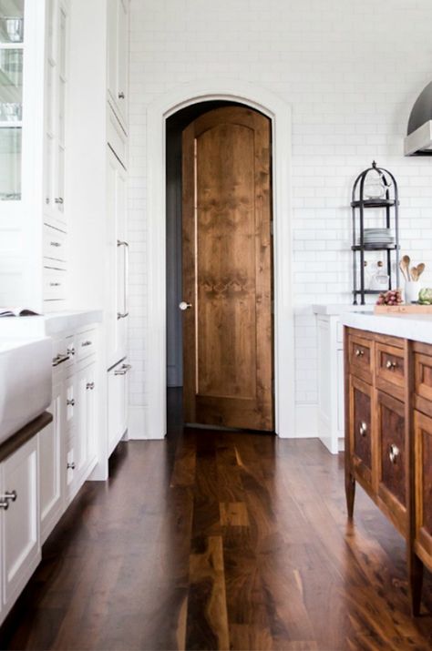 white kitchen with a stained hardwood floor and wood island and door - stunning! White Cabinets, Classic Kitchen, Home Modern, French Farmhouse, Wood Doors Interior, Style At Home, Wood Cabinets, Wood Flooring, Home Fashion